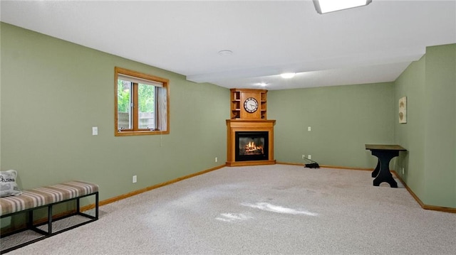 E3313 Jennifer Ln, Eau Claire, WI 54701 - unfurnished room with a glass covered fireplace, carpet floors, and baseboards