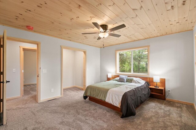 2806 3rd Ct, Oxford, WI 53952 - carpeted bedroom featuring wooden ceiling, ceiling fan, and baseboards