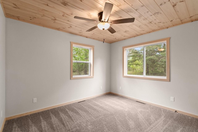 2806 3rd Ct, Oxford, WI 53952 - carpeted empty room featuring wooden ceiling, ceiling fan, and baseboards