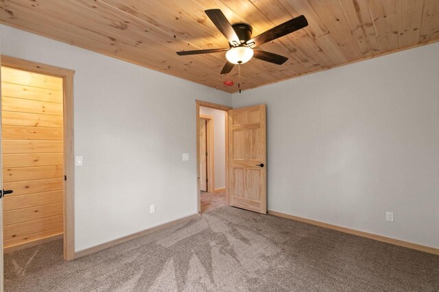 2806 3rd Ct, Oxford, WI 53952 - carpeted empty room featuring a ceiling fan, wood ceiling, and baseboards