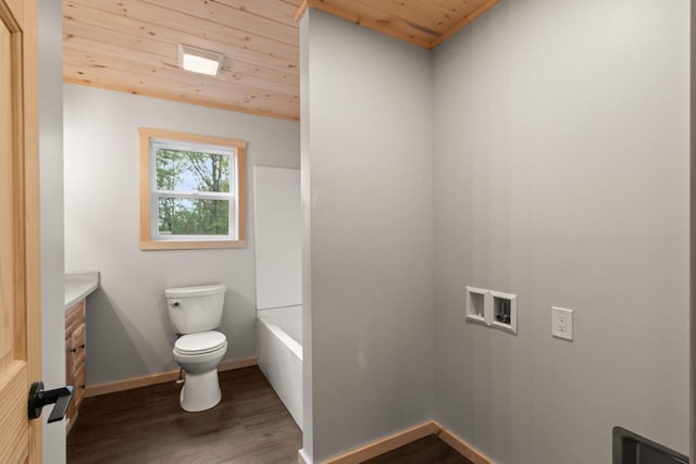 2806 3rd Ct, Oxford, WI 53952 - bathroom featuring wood ceiling, wood finished floors, vanity, toilet, and a bath