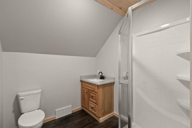 2806 3rd Ct, Oxford, WI 53952 - bathroom with vaulted ceiling, a stall shower, wood finished floors, toilet, and vanity