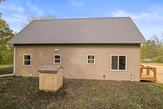 2806 3rd Ct, Oxford, WI 53952 - view of side of property featuring metal roof, a wooden deck, and an outdoor structure