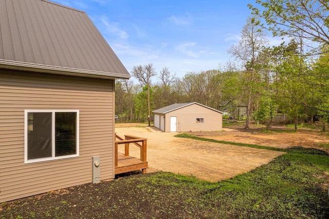 2806 3rd Ct, Oxford, WI 53952 - view of yard with driveway, an outbuilding, and a detached garage