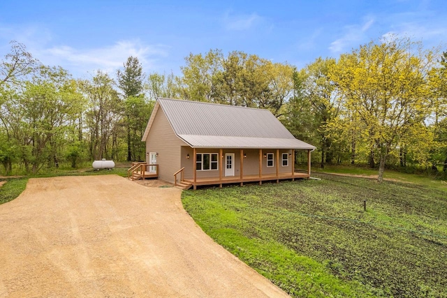 2806 3rd Ct, Oxford, WI 53952 - view of front of home featuring metal roof and view of wooded area