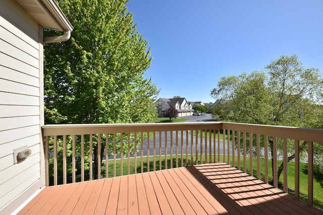 wooden terrace featuring a residential view
