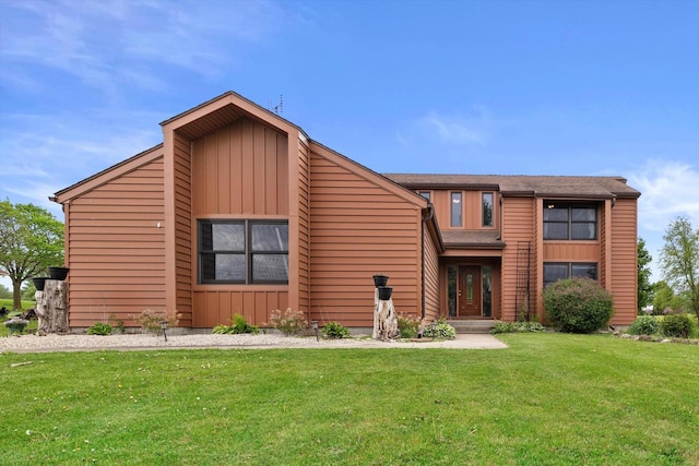 N6120 Evergreen Dr, Elkhorn, WI 53121 - mid-century home with a front lawn and board and batten siding