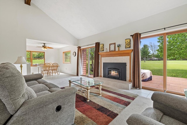 N6120 Evergreen Dr, Elkhorn, WI 53121 - tiled living area with high vaulted ceiling, a tiled fireplace, and a ceiling fan