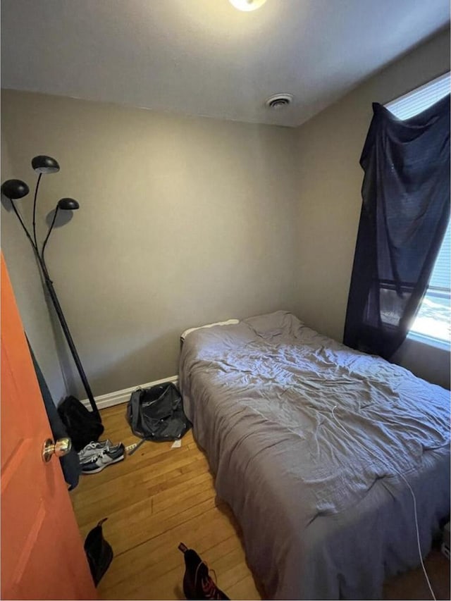 812 E Clarke St Unit 814, Milwaukee, WI 53212 - bedroom featuring wood-type flooring and baseboards