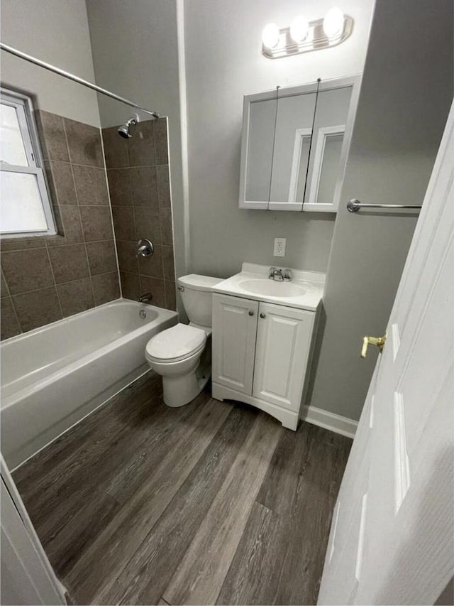 812 E Clarke St Unit 814, Milwaukee, WI 53212 - bathroom with wood finished floors, toilet, vanity, and washtub / shower combination