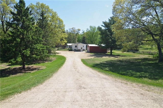 W2585 County Road R, Durand, WI 54736 - single story home featuring dirt driveway and a front lawn