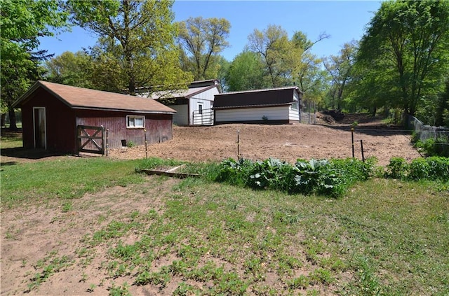 W2585 County Road R, Durand, WI 54736 - view of yard featuring fence and an outdoor structure