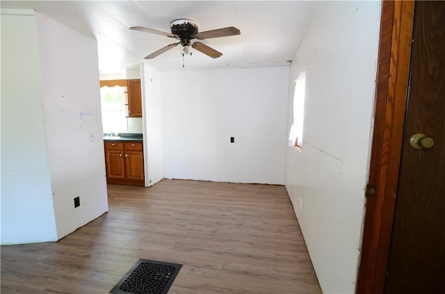 W2585 County Road R, Durand, WI 54736 - spare room with a ceiling fan and light wood finished floors