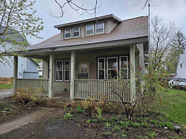 308 W Prospect St, Endeavor, WI 53930 - bungalow-style house with covered porch and a shingled roof