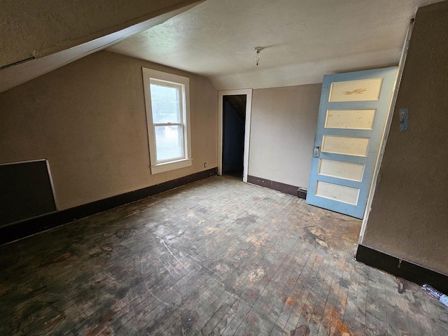 308 W Prospect St, Endeavor, WI 53930 - bonus room featuring vaulted ceiling, wood-type flooring, and baseboards