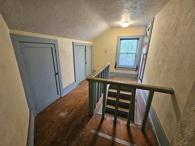 308 W Prospect St, Endeavor, WI 53930 - stairs with a textured wall, a textured ceiling, wood-type flooring, and lofted ceiling