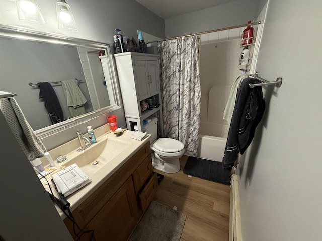 220-222 Lincoln St, Brooklyn, WI 53521 - bathroom with wood finished floors, vanity, toilet, and shower / bath combination with curtain