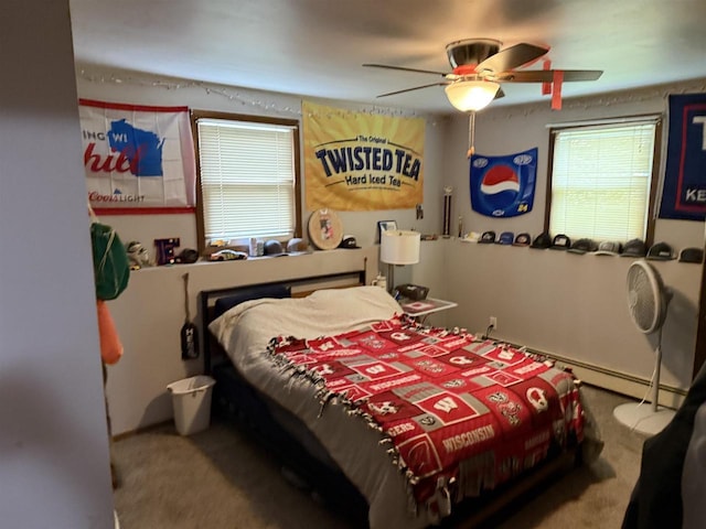 220-222 Lincoln St, Brooklyn, WI 53521 - bedroom with carpet, baseboard heating, and a ceiling fan
