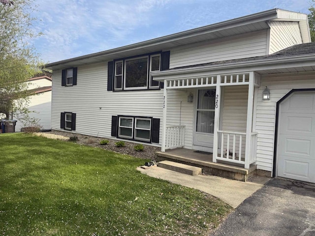 220-222 Lincoln St, Brooklyn, WI 53521 - view of front of property with a front lawn and a garage