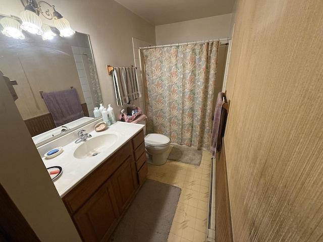 220-222 Lincoln St, Brooklyn, WI 53521 - bathroom featuring vanity, toilet, a shower with curtain, tile patterned floors, and a chandelier