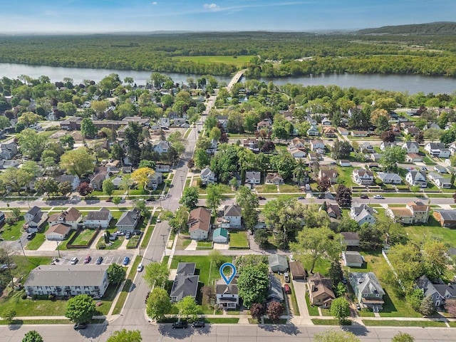 610 W Franklin St, Portage, WI 53901 - aerial view of property and surrounding area with a nearby body of water, a heavily wooded area, and nearby suburban area