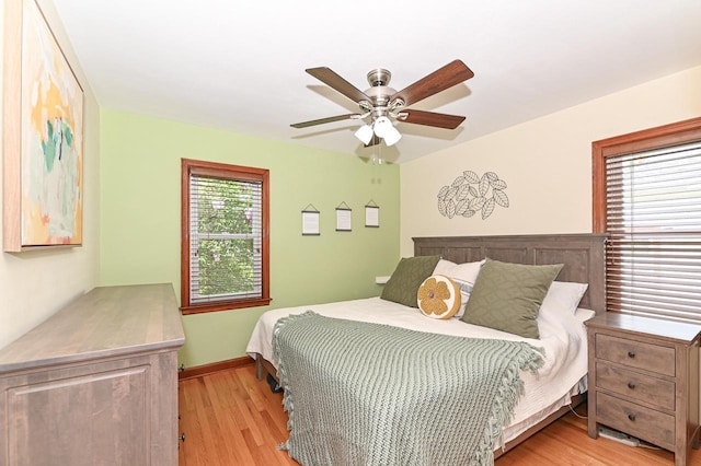 2377 S 73rd St, West Allis, WI 53219 - bedroom with light wood finished floors, a ceiling fan, and baseboards