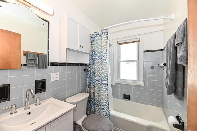 2377 S 73rd St, West Allis, WI 53219 - bathroom with tile walls, toilet, vanity, and shower / bathtub combination with curtain