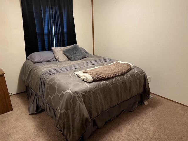 bedroom with light colored carpet
