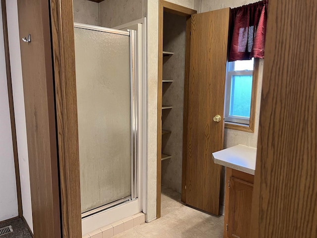 full bathroom with a shower stall