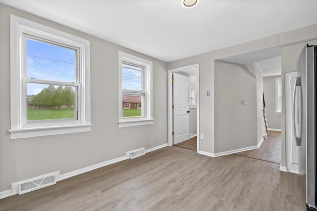 1143 S 23rd St, Manitowoc, WI 54220 - unfurnished room featuring wood finished floors and baseboards