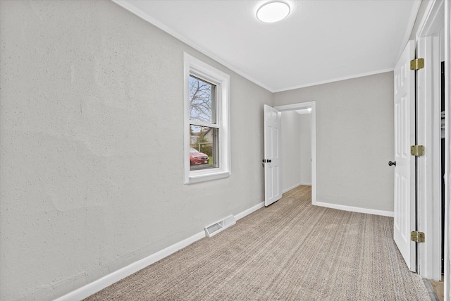 1143 S 23rd St, Manitowoc, WI 54220 - unfurnished bedroom with carpet, ornamental molding, and baseboards