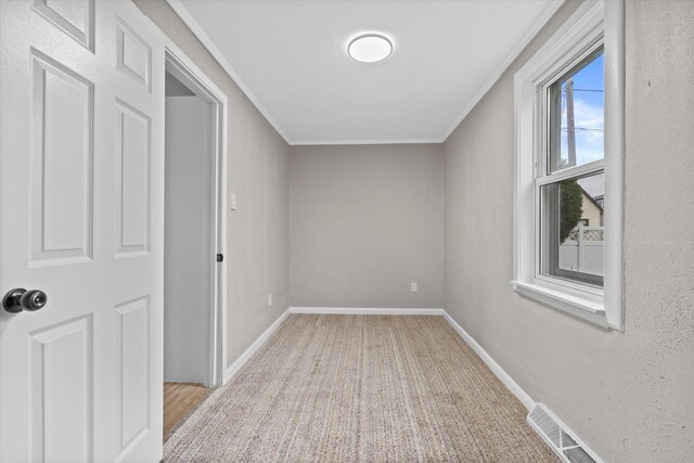 1143 S 23rd St, Manitowoc, WI 54220 - unfurnished room with crown molding and baseboards