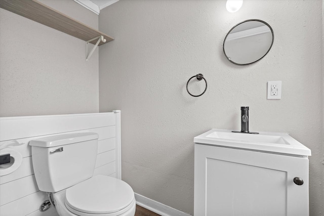 1143 S 23rd St, Manitowoc, WI 54220 - bathroom featuring toilet, vanity, and baseboards