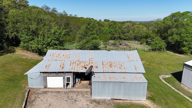 18051 Ideal Rd, Sparta, WI 54656 - view of outdoor structure with driveway, a forest view, and an outbuilding