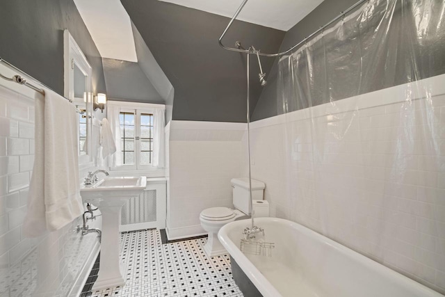 2663 N Wahl Ave, Milwaukee, WI 53211 - full bathroom featuring toilet, shower / tub combo with curtain, and tile walls