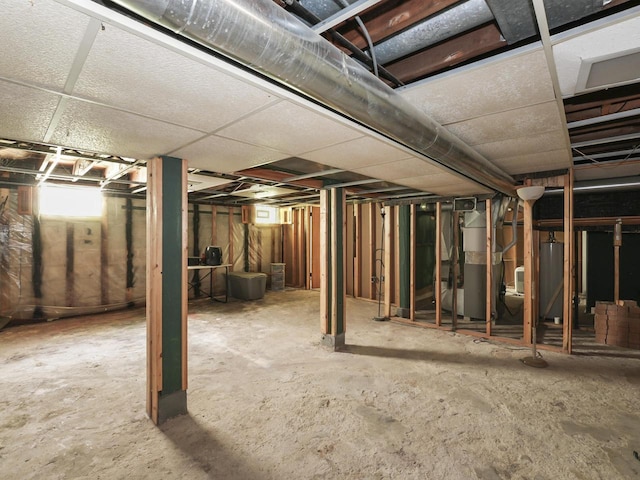 below grade area featuring water heater