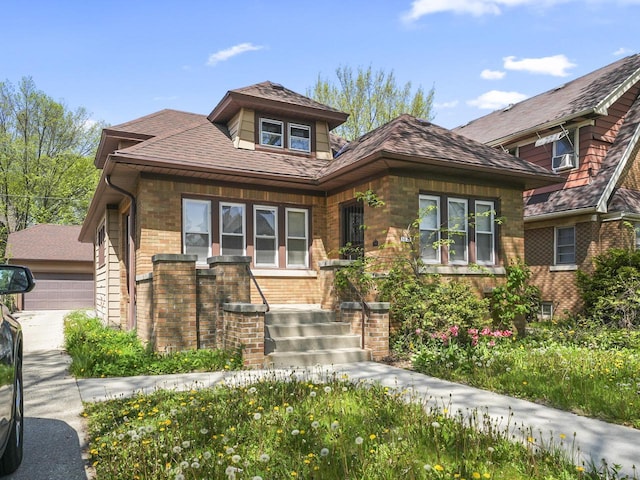 view of front of house featuring brick siding and a garage