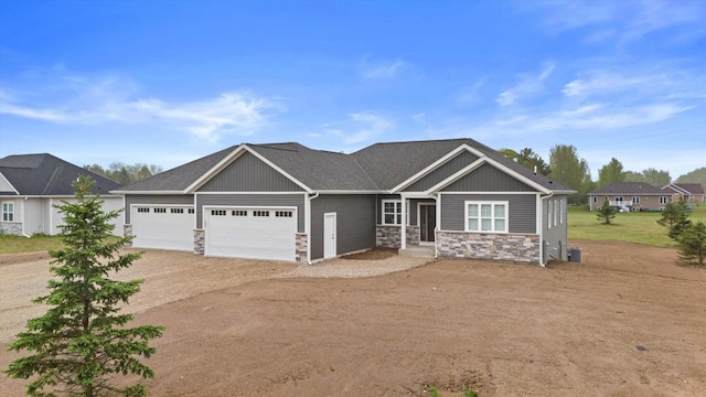 2161 Wallace Lake Rd Unit Lt10, West Bend, WI 53090 - craftsman-style home with stone siding, driveway, an attached garage, and board and batten siding
