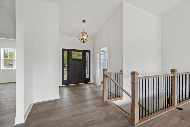 2161 Wallace Lake Rd Unit Lt10, West Bend, WI 53090 - foyer featuring wood finished floors, a chandelier, baseboards, and high vaulted ceiling