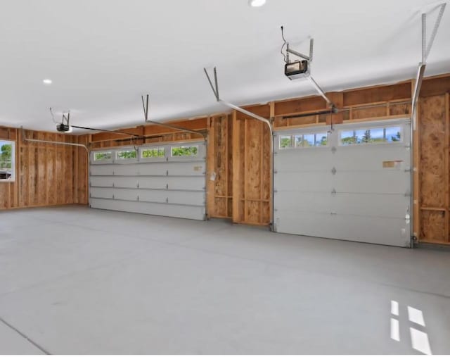 2161 Wallace Lake Rd Unit Lt10, West Bend, WI 53090 - garage featuring a garage door opener and recessed lighting
