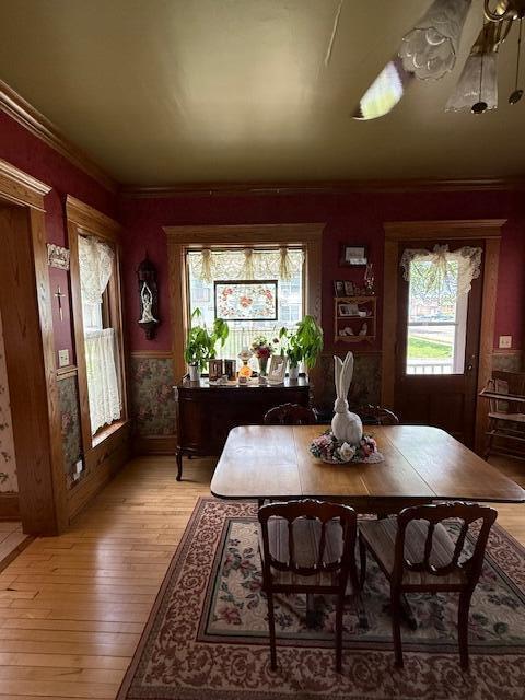 400 S Water St, Sparta, WI 54656 - dining room with plenty of natural light, light wood-style floors, ornamental molding, and baseboards