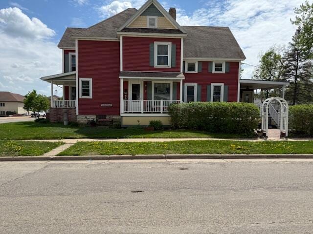 400 S Water St, Sparta, WI 54656 - view of front of house featuring covered porch and a chimney