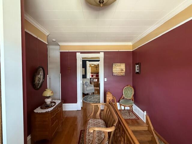 400 S Water St, Sparta, WI 54656 - corridor with wood finished floors, crown molding, and baseboards