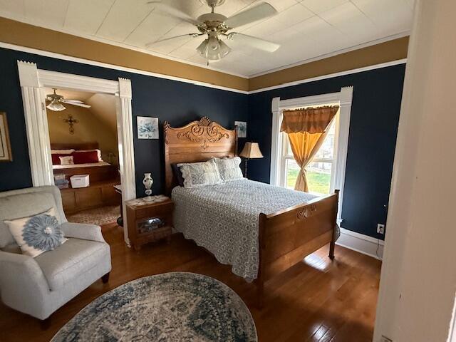 400 S Water St, Sparta, WI 54656 - bedroom with wood finished floors, ceiling fan, baseboards, and crown molding