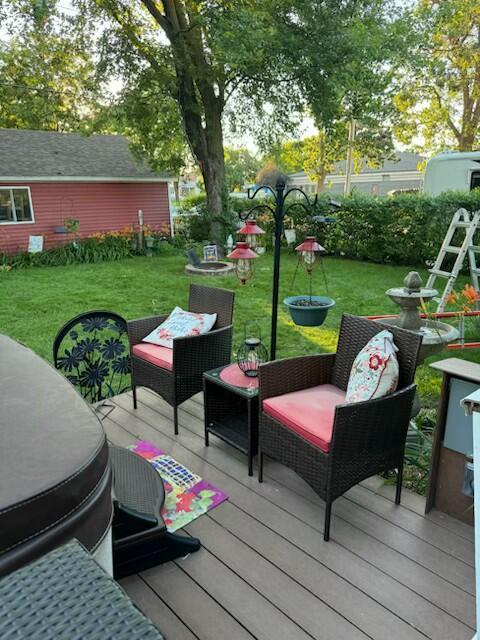 400 S Water St, Sparta, WI 54656 - wooden deck featuring a lawn and outdoor lounge area