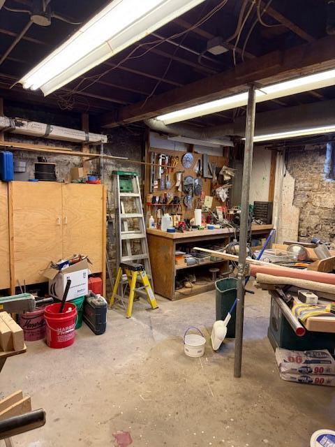 400 S Water St, Sparta, WI 54656 - unfinished basement featuring a workshop area