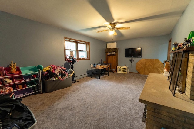 105 Glenview Dr, Tomah, WI 54660 - playroom with ceiling fan, carpet flooring, and a fireplace