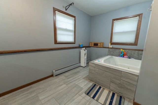 105 Glenview Dr, Tomah, WI 54660 - full bathroom with a baseboard radiator and a bath