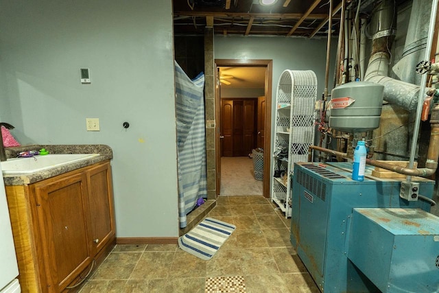 105 Glenview Dr, Tomah, WI 54660 - clothes washing area with a heating unit and baseboards