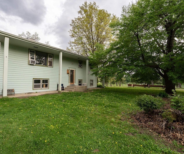 105 Glenview Dr, Tomah, WI 54660 - rear view of house featuring a yard